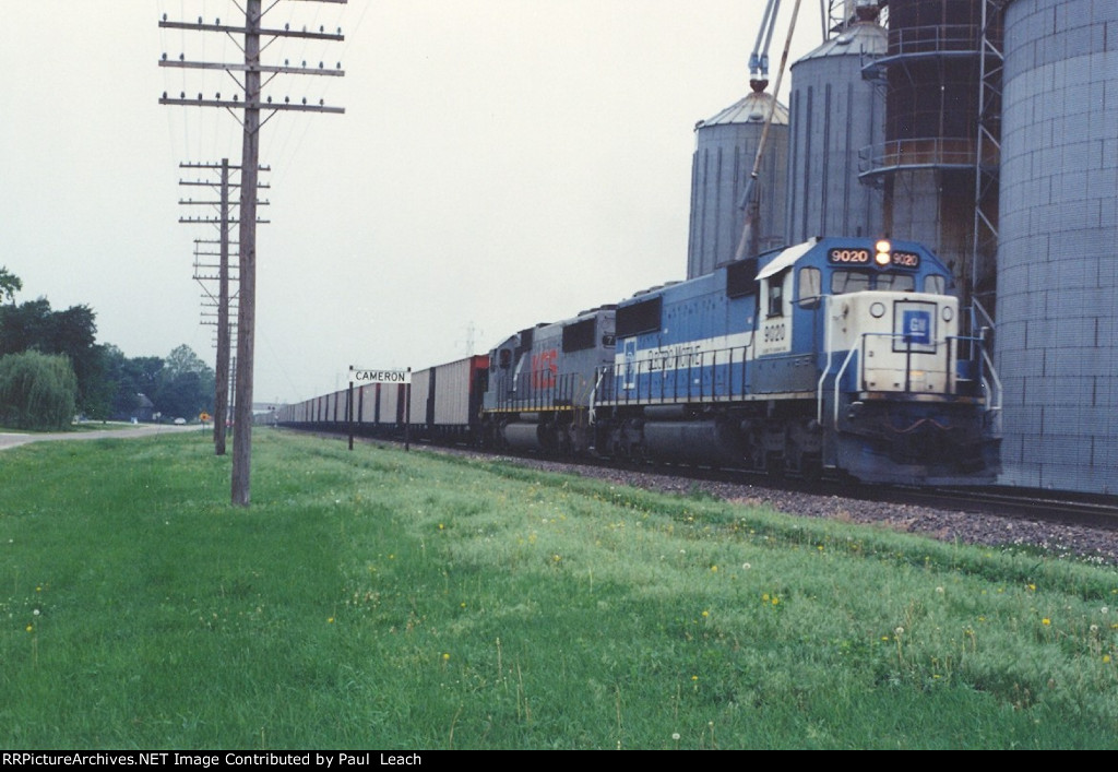 Loaded coal train rolls east